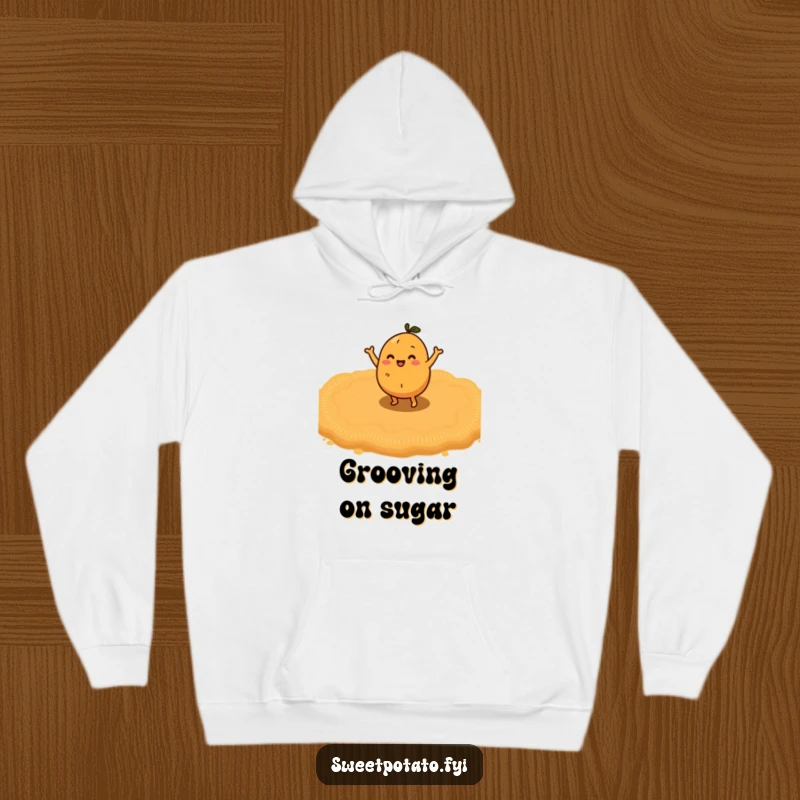 Funny sweet potato character performing a happy little dance on a lush bed of brown sugar, a soft and funny hoodie.