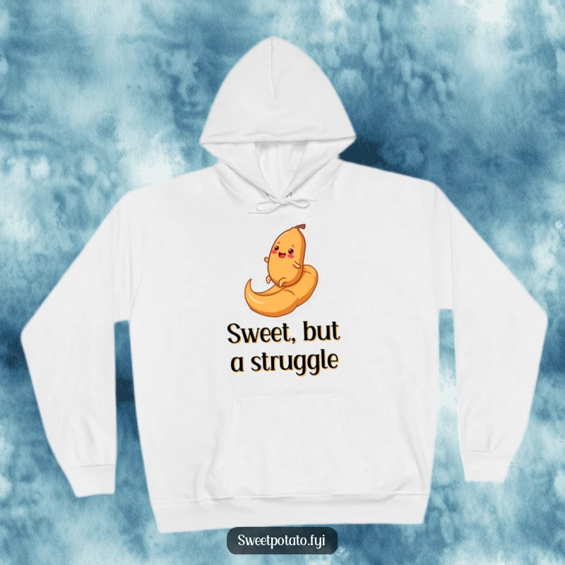 Funny hoodie depicting a joyful sweet potato character rolling uphill on a massive caramel swirl, offering warmth and a hearty dose of humor.