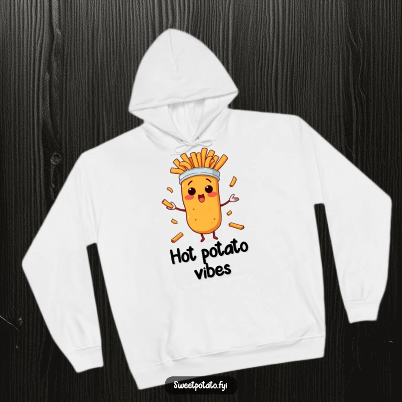 Funny hoodie featuring a surprised cartoon sweet potato character frantically juggling its own fries, emitting an aura of humorous panic.