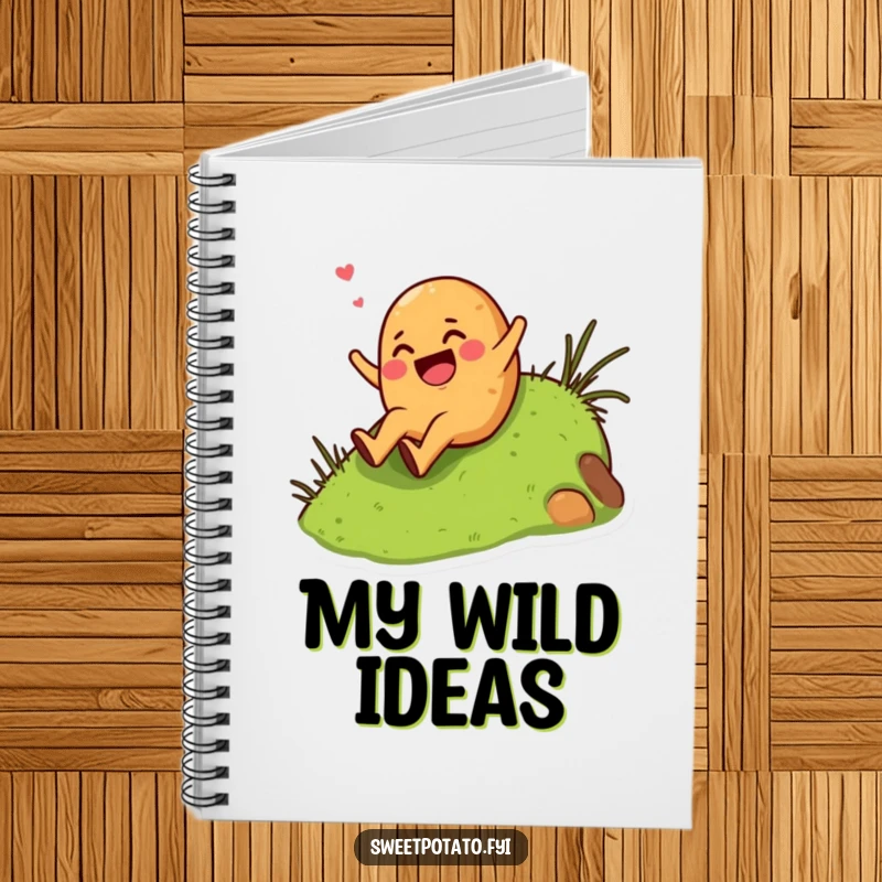 Funny giggling sweet potato character enthusiastically sliding down a grassy hill, featured on a humorous notebook.