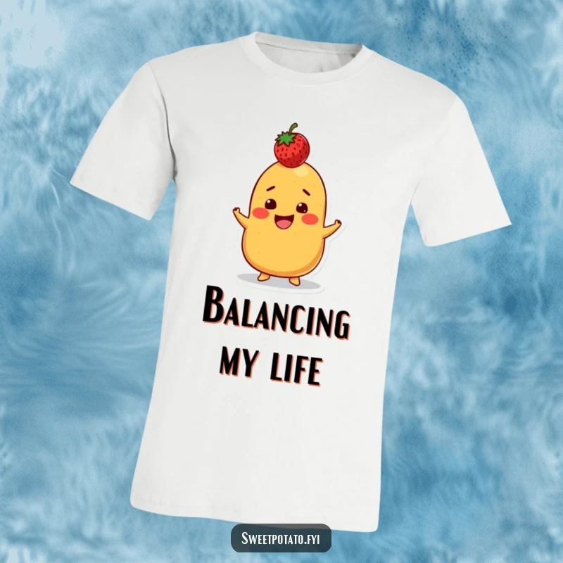 Funny t-shirt showing a sweet potato character with a big grin, skillfully balancing a strawberry on its head, radiating fun and concentration.
